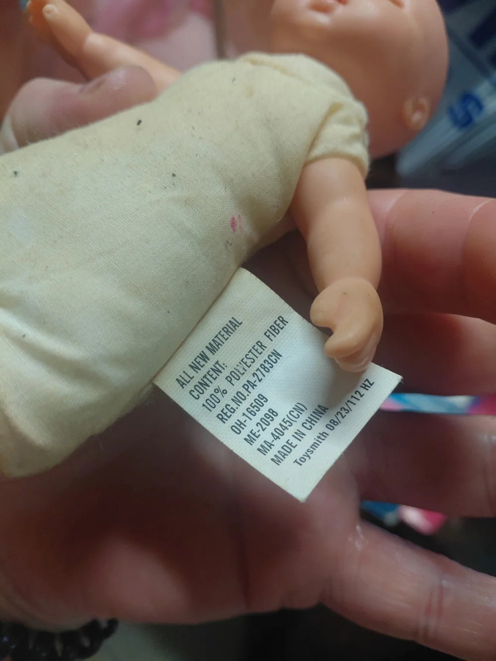 a vintage 1997 Corolle mini baby doll featuring blue eyes and a soft body.